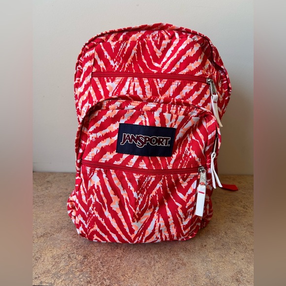 Jansport Handbags - Jansport Backpack in Red, Orange and White Animal like print